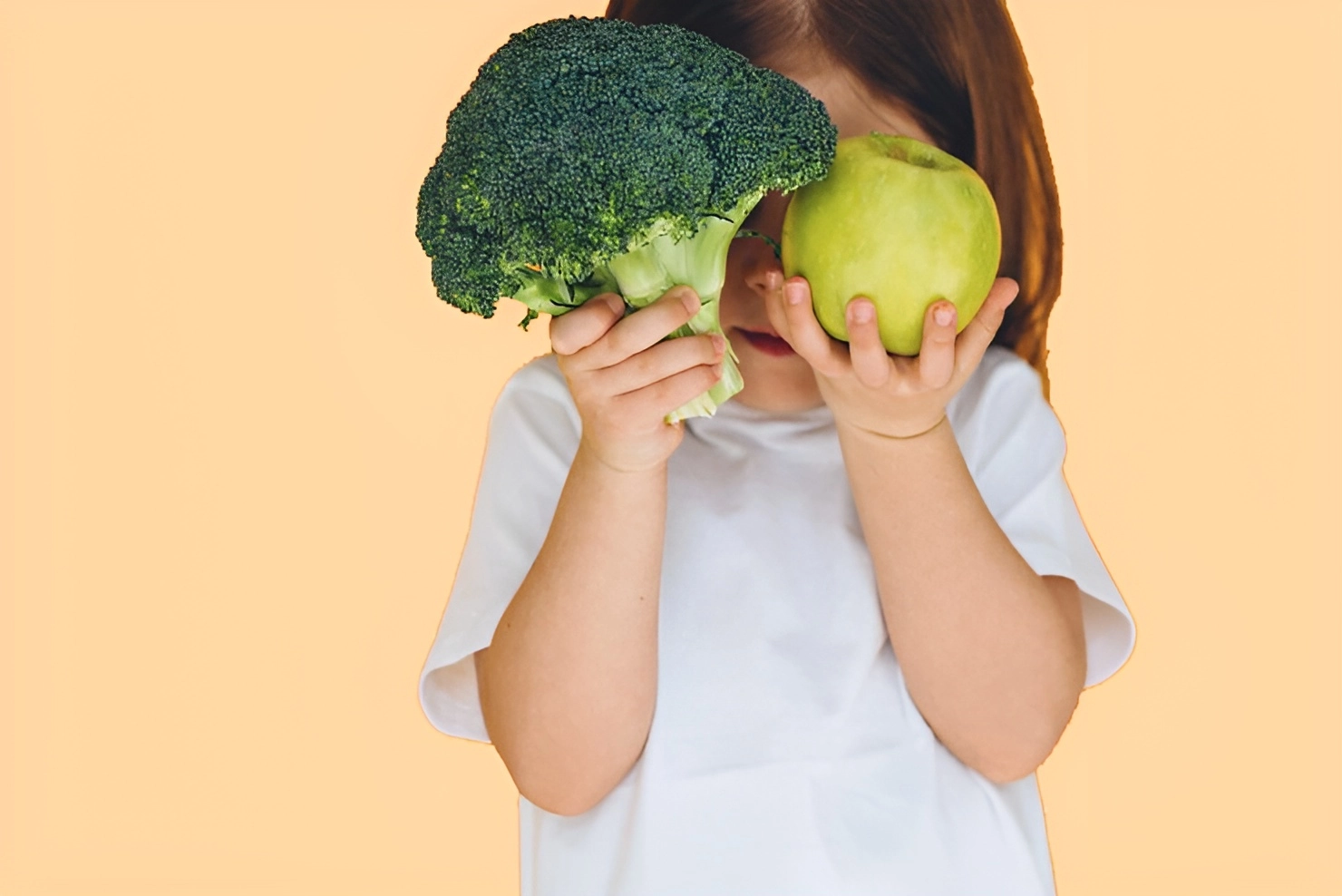 cute-girl-holding-broccoli-apple